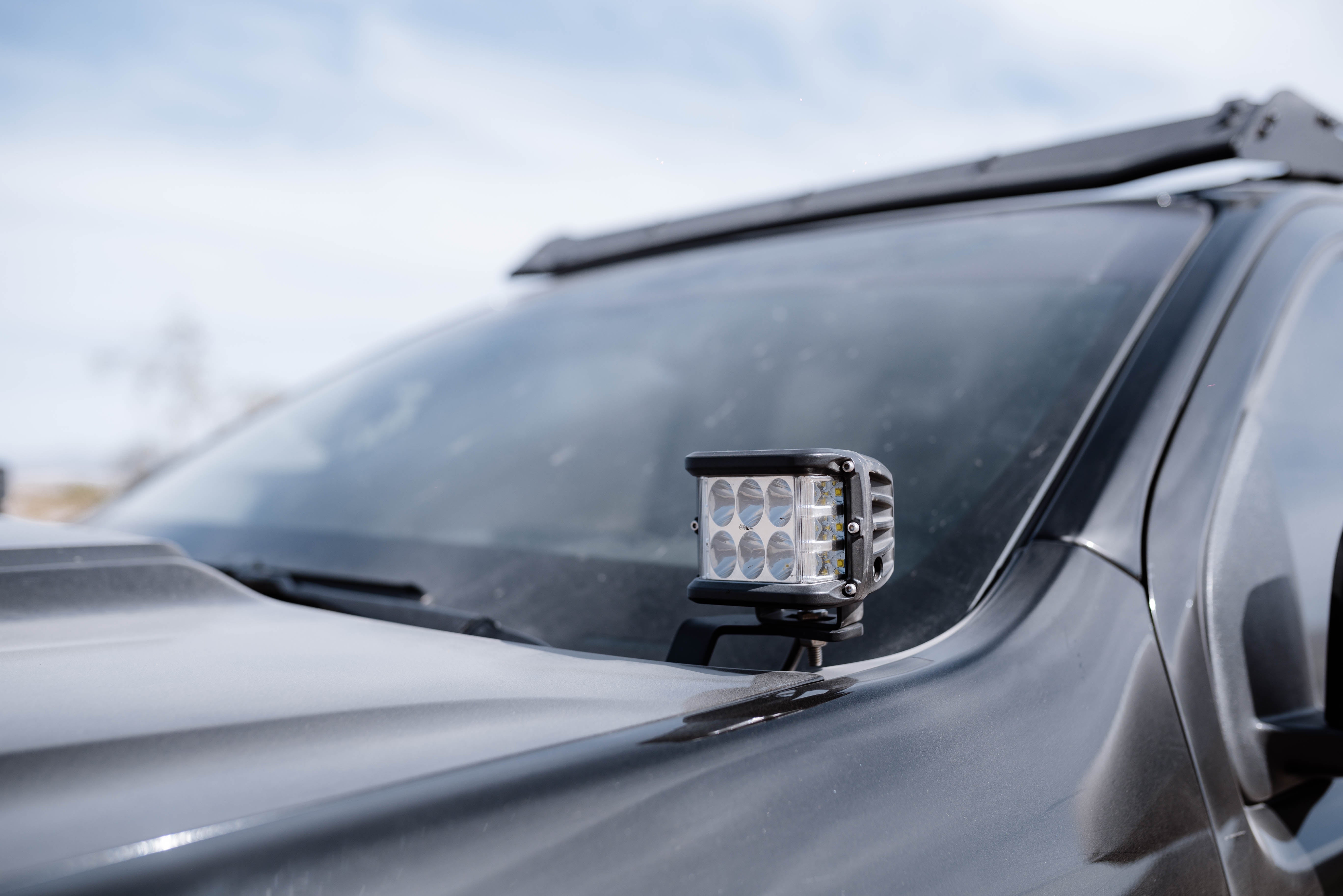 LED ditch light mounted on the hood of an off-road vehicle for overlanding