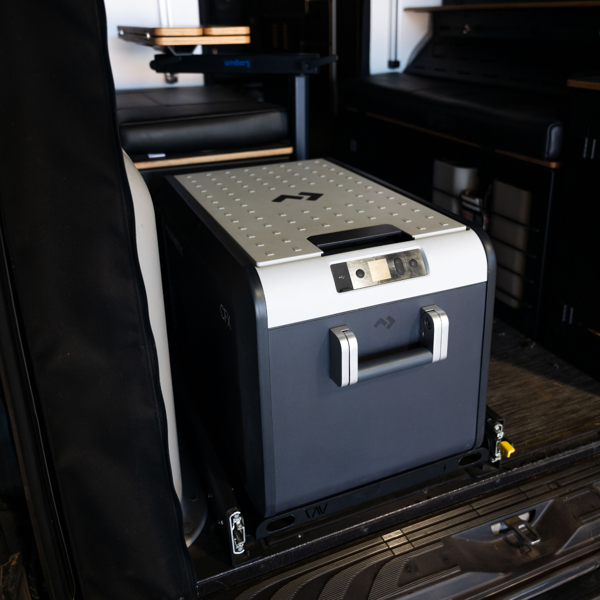 Overland portable fridge freezer installed in SUV, ideal for camping and expedition vehicles