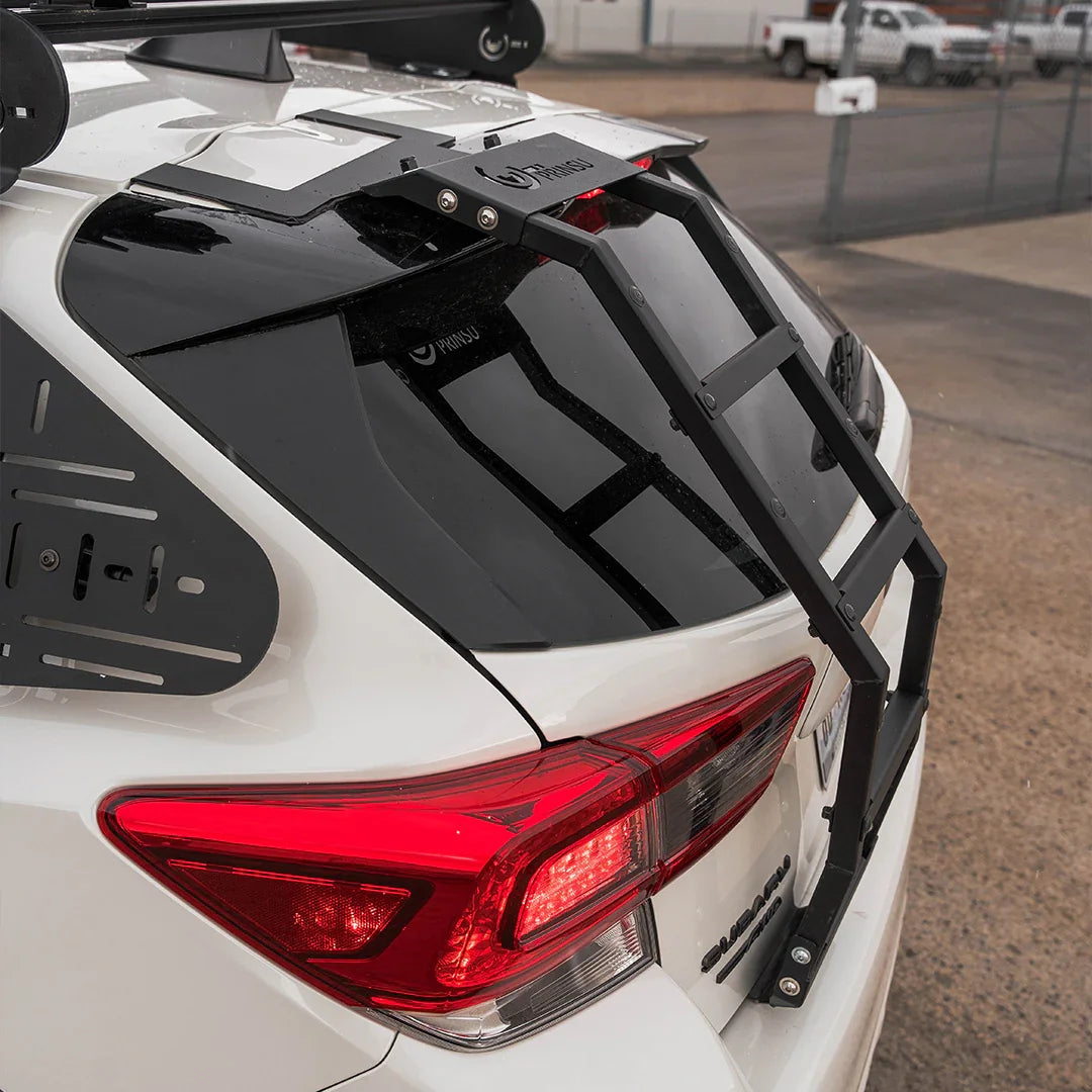 Rear view of Subaru Crosstrek with overlanding ladder and roof rack installed