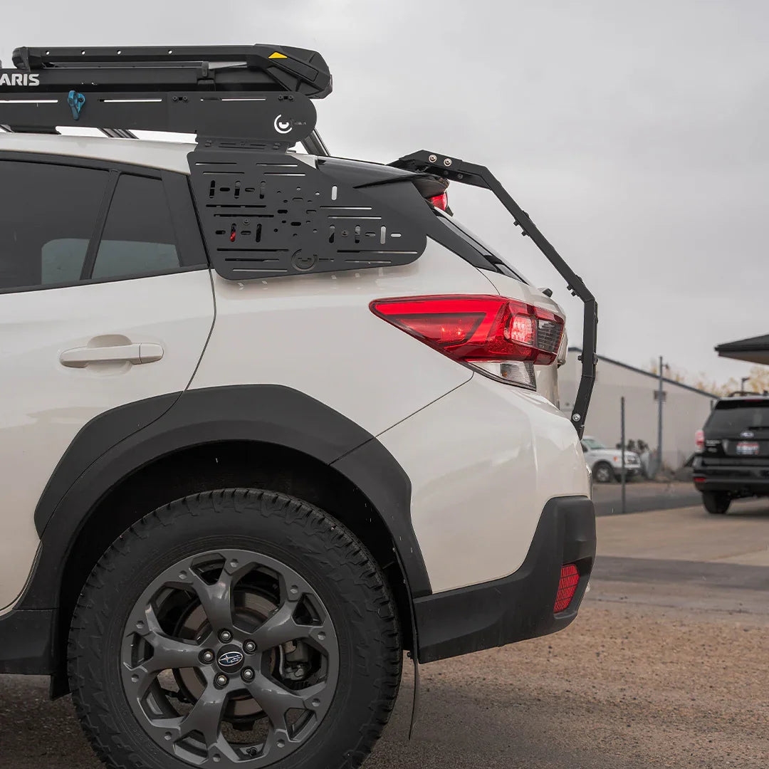 Subaru Crosstrek with rear window panel and roof rack for overlanding accessories