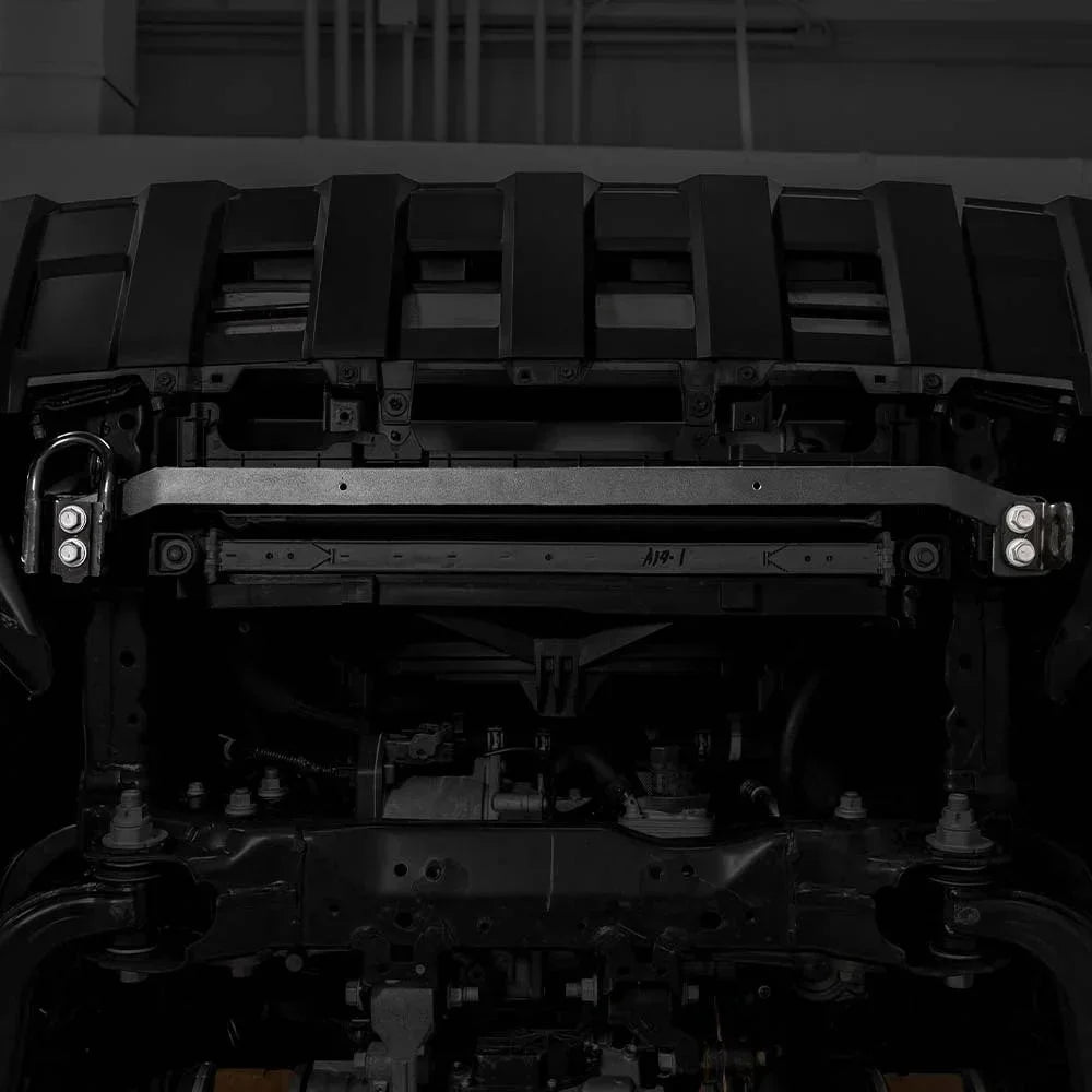 Heavy-duty steel bumper mount on off-road vehicle frame, suitable for overlanding upgrades