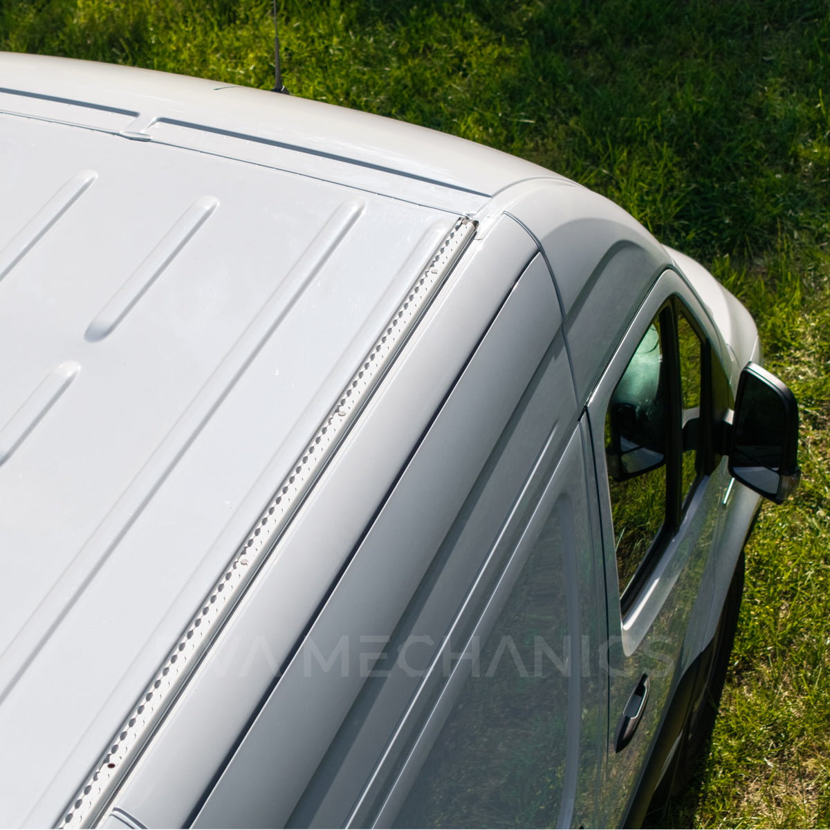 Full-length LoadSpan rails across a Sprinter roof