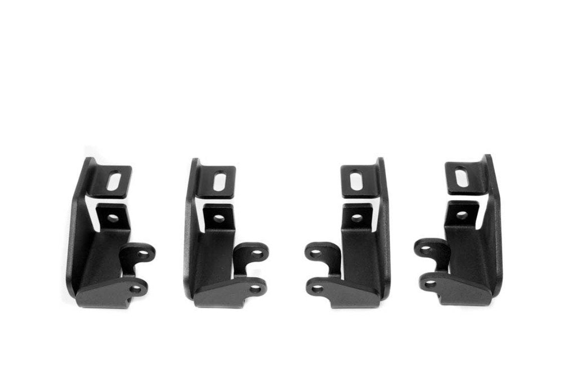 Set of four black steel mounting brackets for off-road vehicle accessories on white background
