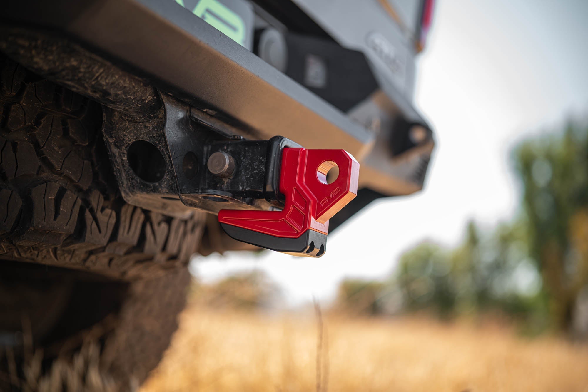 DV8-Xtract-Hitch-Skid-Plate-Red-Installed-1 - NVMOS