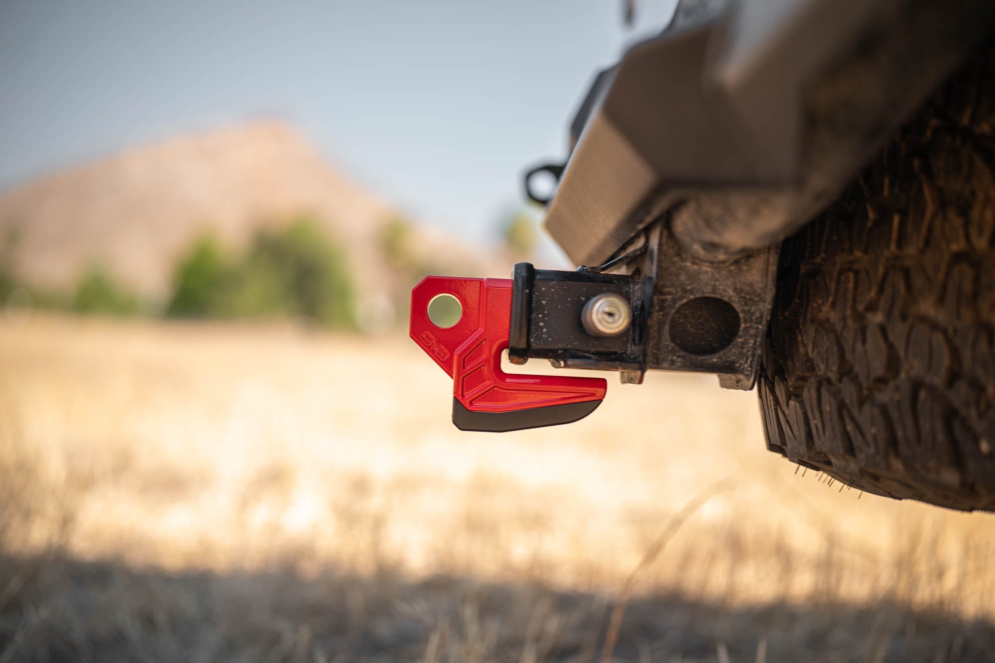 DV8-Xtract-Hitch-Skid-Plate-Red-Installed-2 - NVMOS