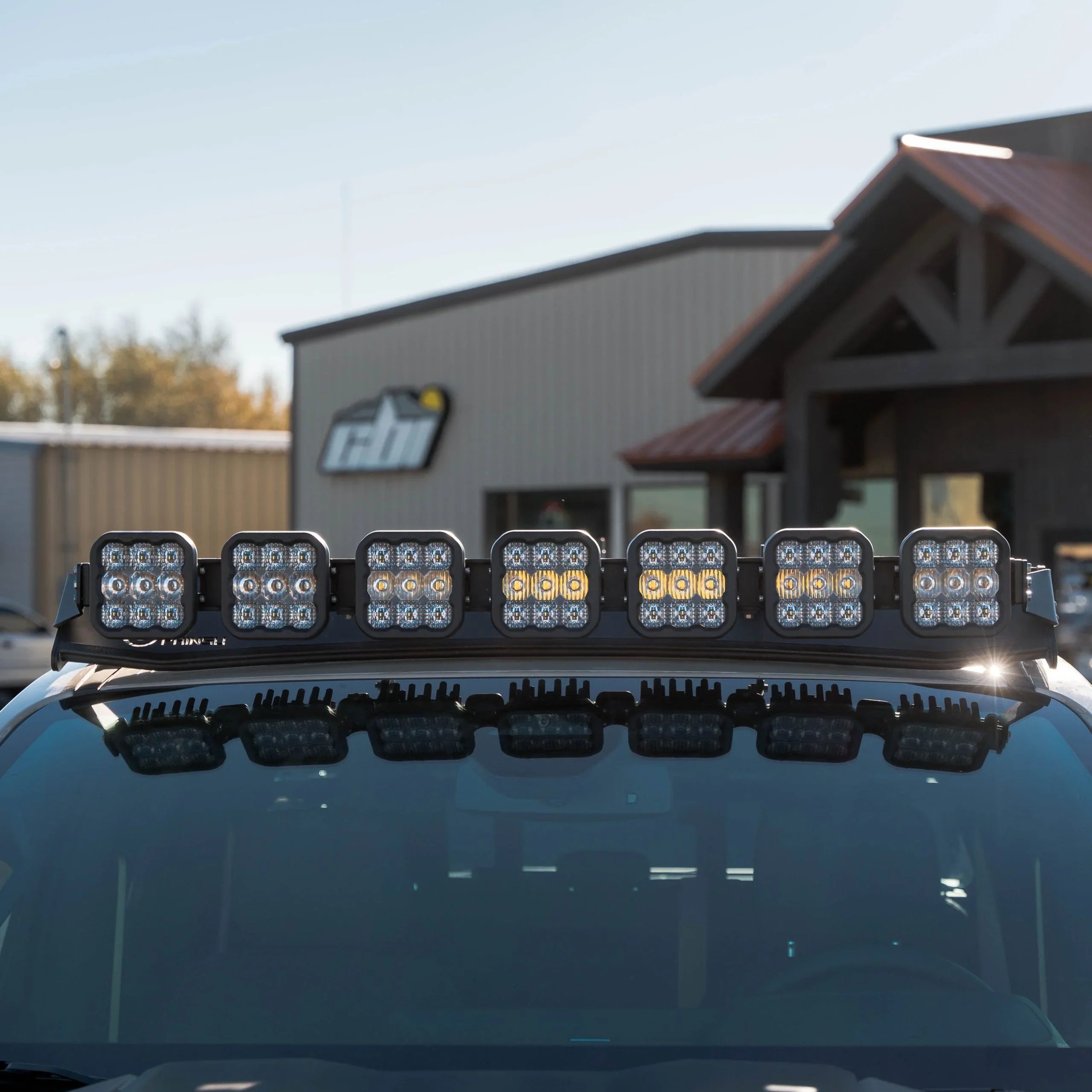 Roof-mounted LED light bar on off-road vehicle, ideal for overlanding and camping gear
