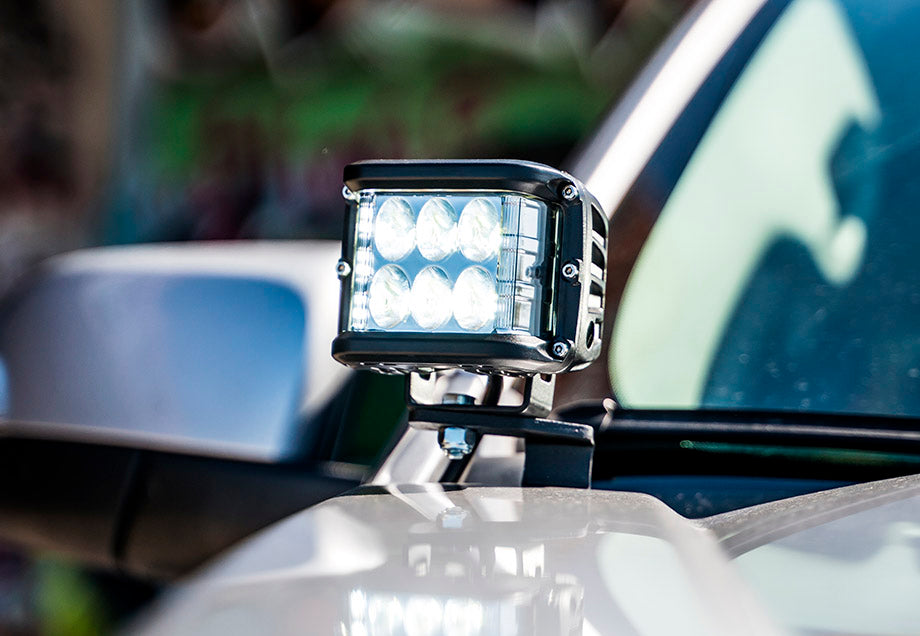 Close-up of LED off-road light mounted on a vehicle for overlanding or camping