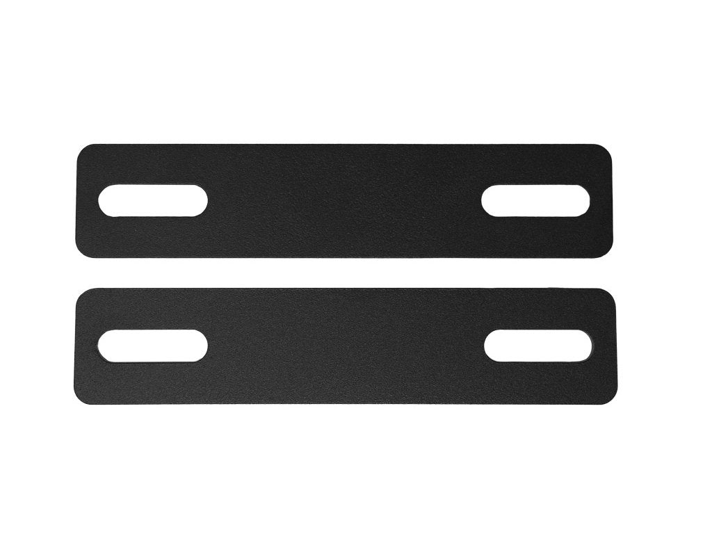 Pair of black metal ditch light bracket extensions with oval mounting slots