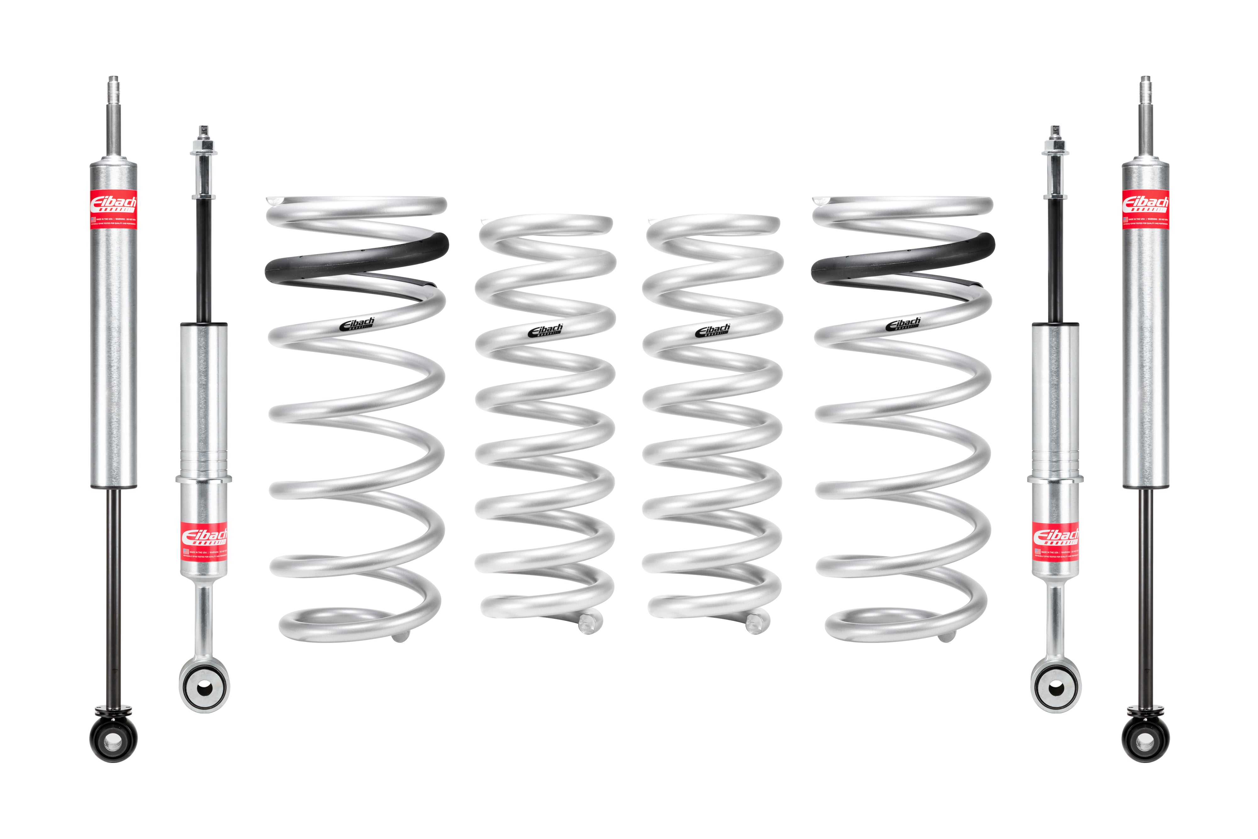 Suspension lift kit with silver coil springs and shock absorbers for off-road vehicles