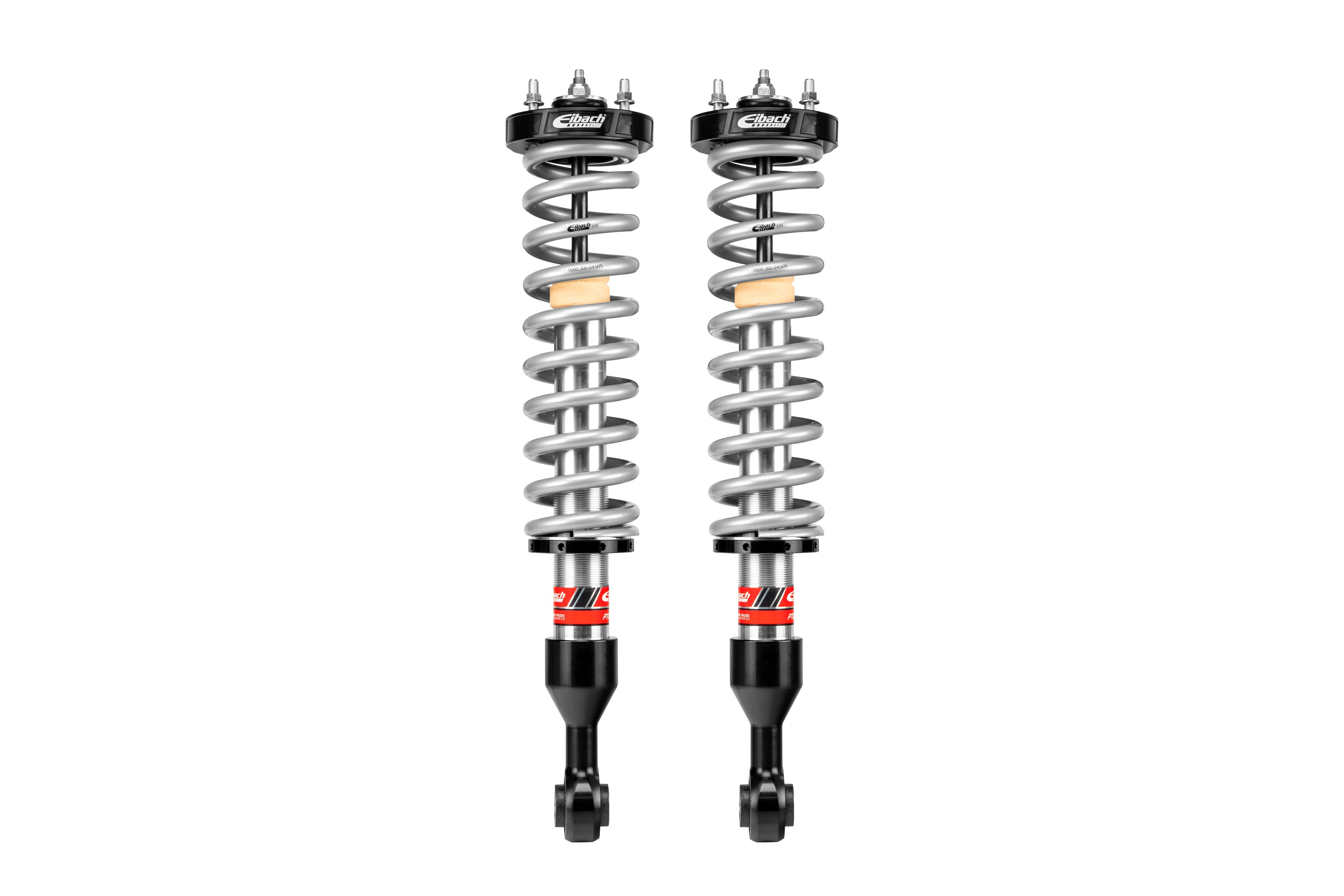 Pair of heavy-duty coilover shocks for off-road and overland vehicles, isolated on white