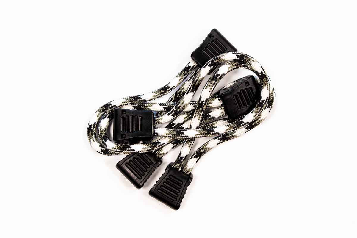 Pair of black and white braided utility straps with plastic buckles for overlanding gear