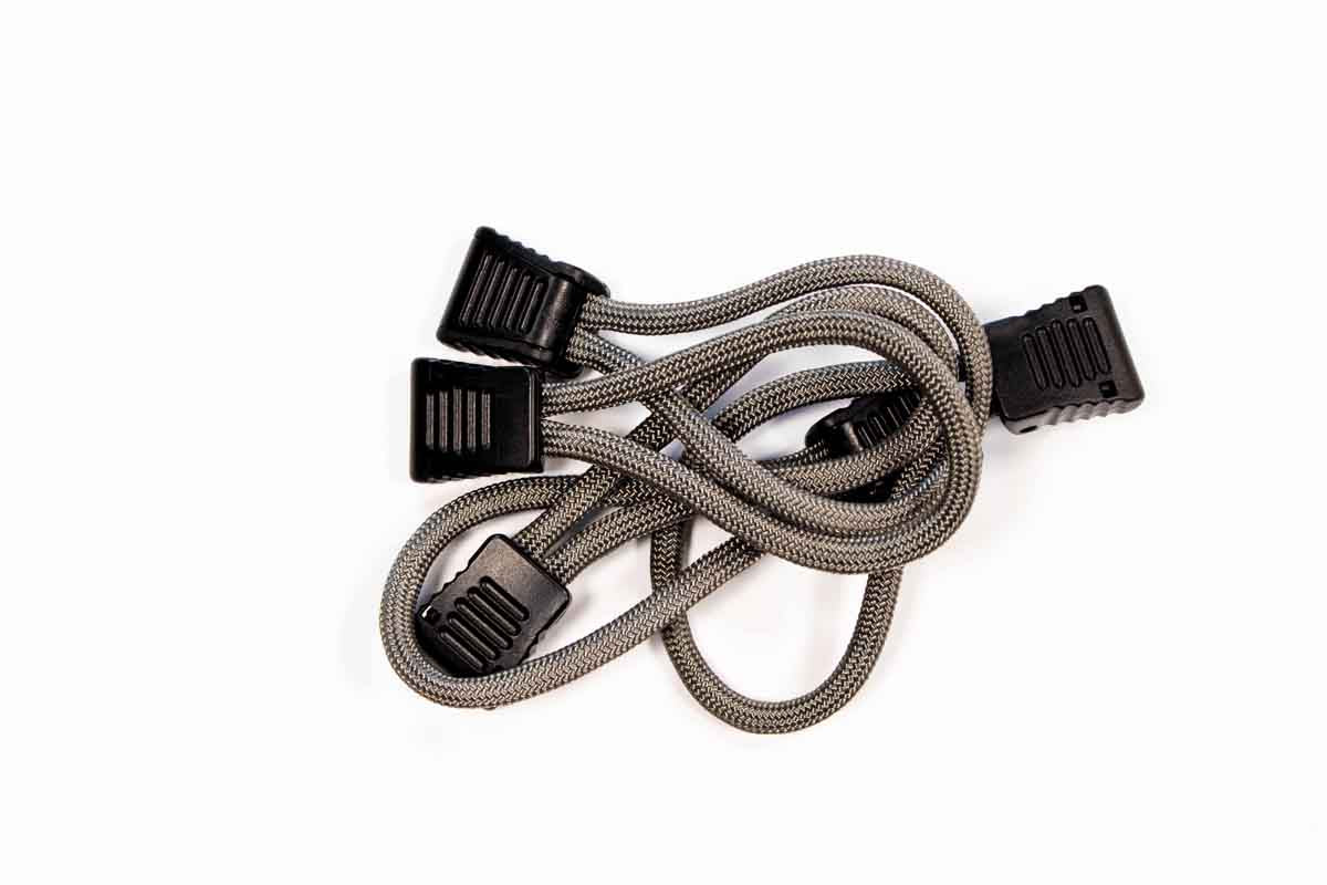 Heavy-duty gray bungee cord with black plastic hooks for overlanding and camping gear
