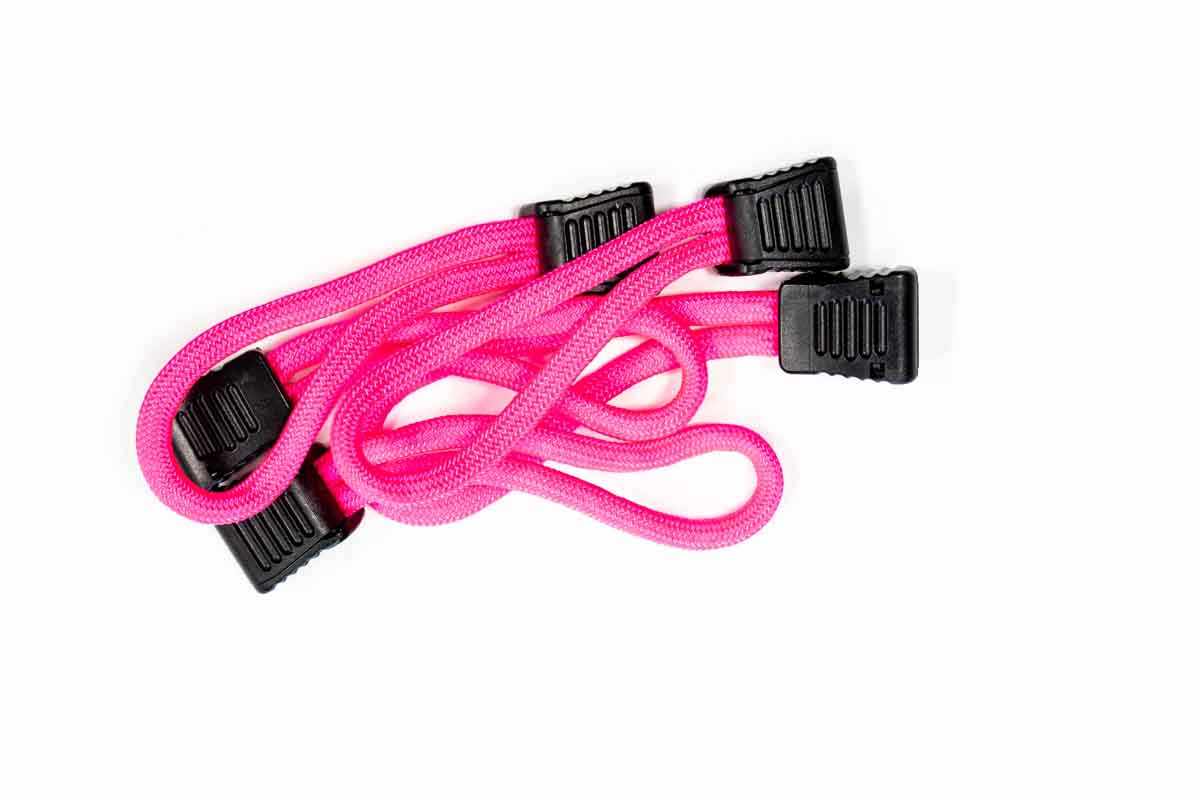 Pink elastic bungee cords with black plastic hooks for overlanding and camping gear
