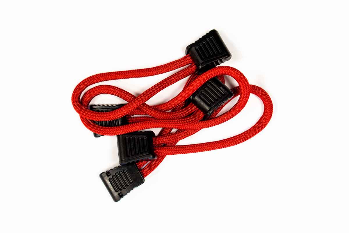 Red utility bungee cord with black plastic hooks for overlanding or camping gear
