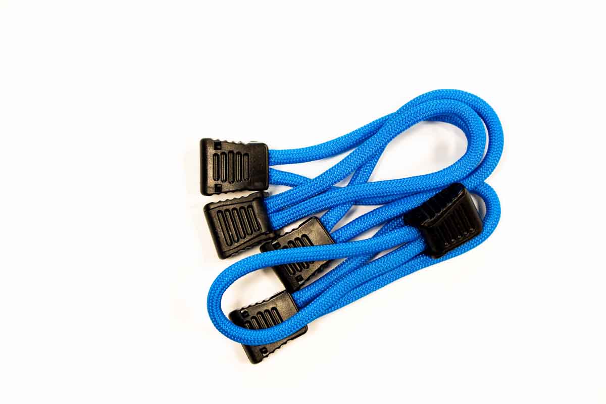 Blue bungee cords with black plastic hooks for overlanding or camping gear organization