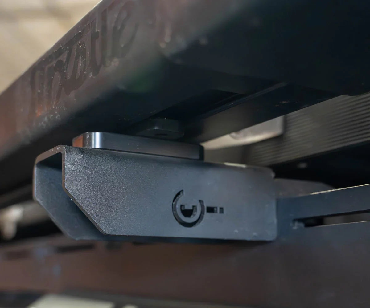 Close-up of a heavy-duty roof rack mounting bracket for off-road vehicles