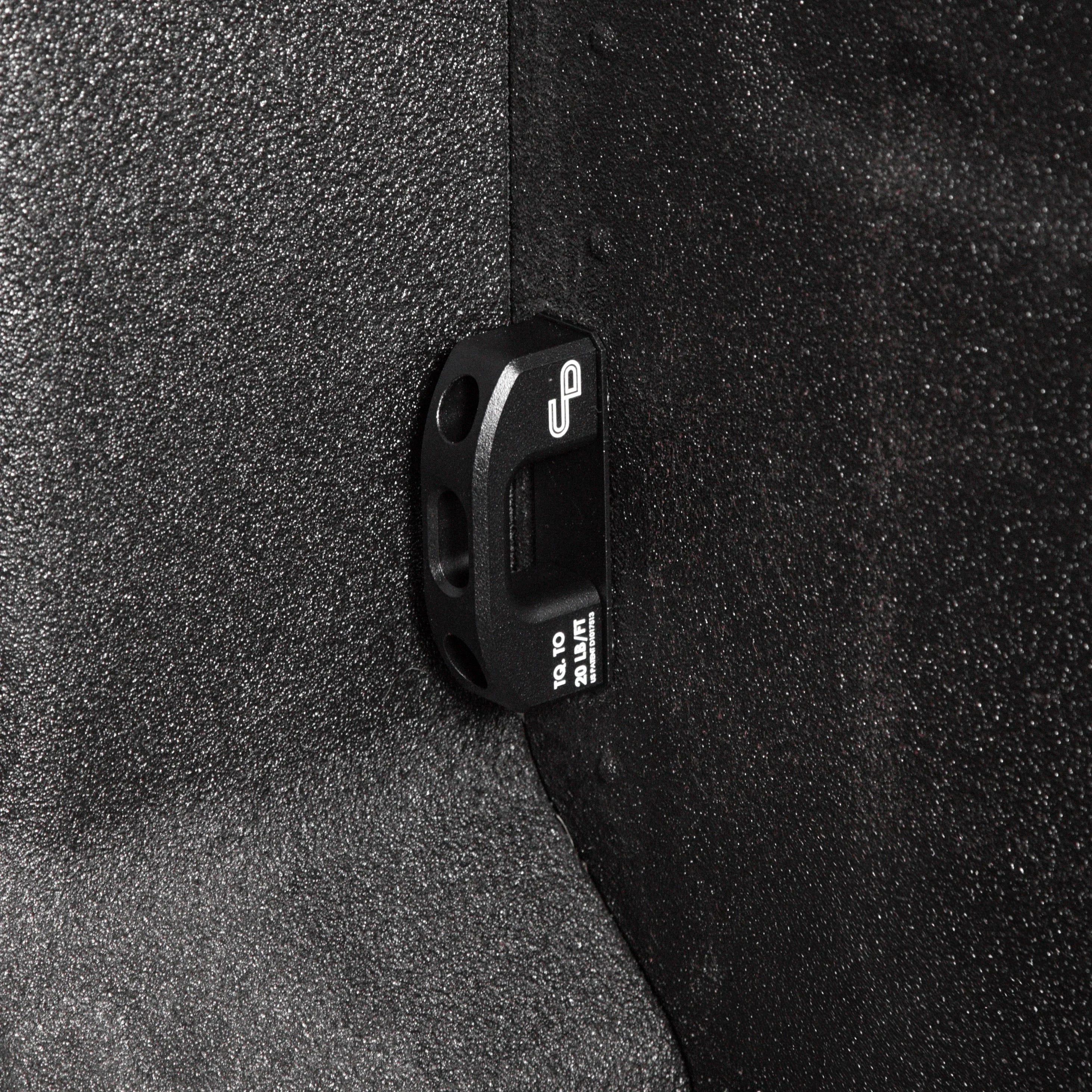 Black powder-coated bed tie down mounted on Ford F250 F350 Super Duty truck bed