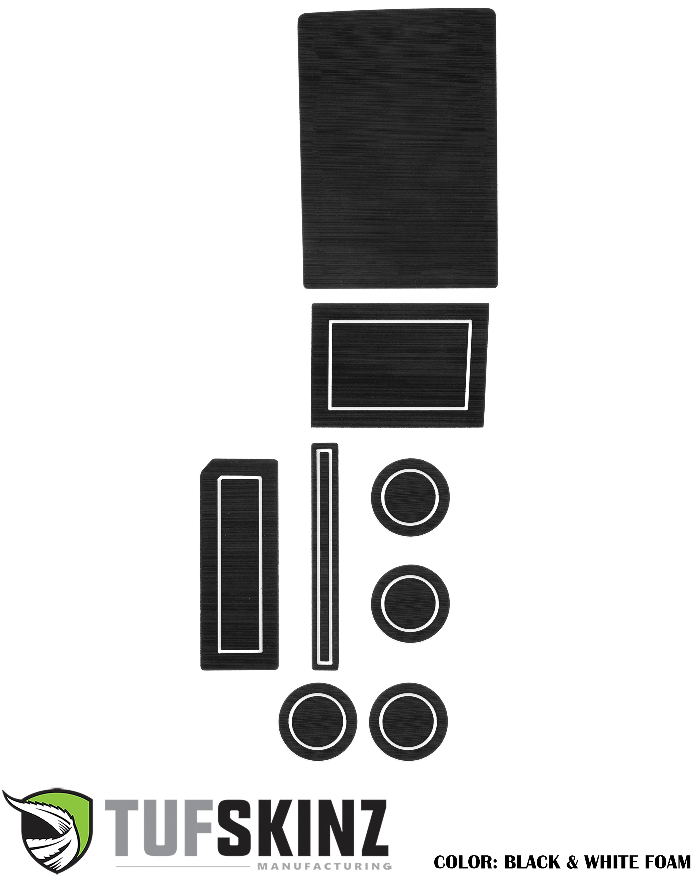 Black and white foam interior accessory inserts for vehicle console and cup holders.