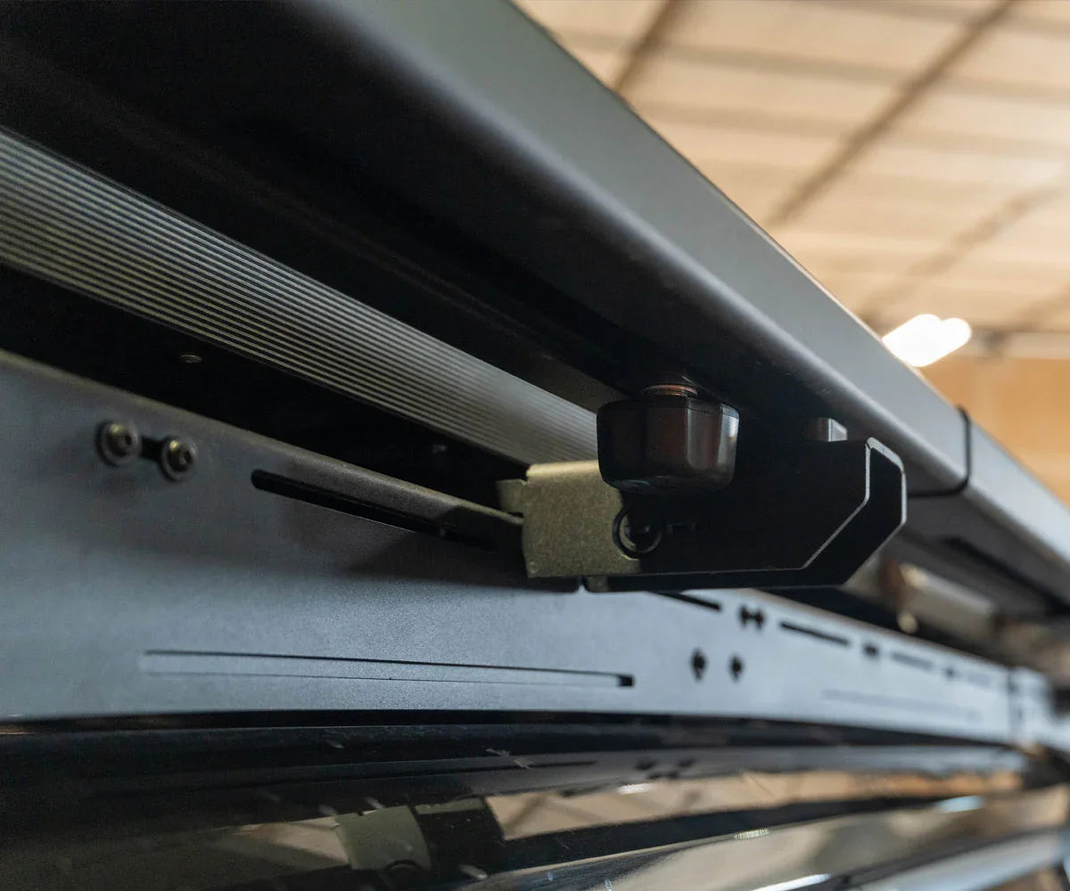 Close-up of roof rack mounting bracket on off-road vehicle, ideal for overlanding gear