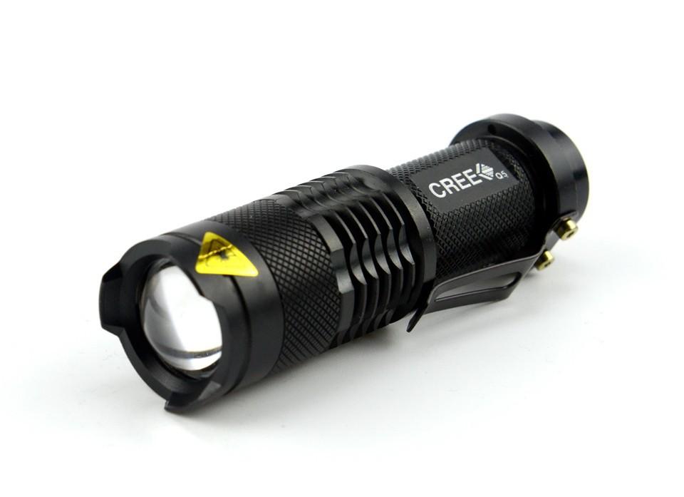Compact black tactical LED flashlight with zoom lens and side clip, ideal for camping gear