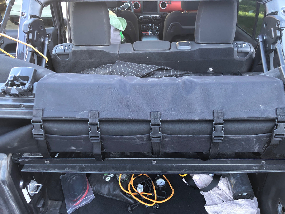 Diabolical Inc soft top cover on a folded Jeep Wrangler soft top