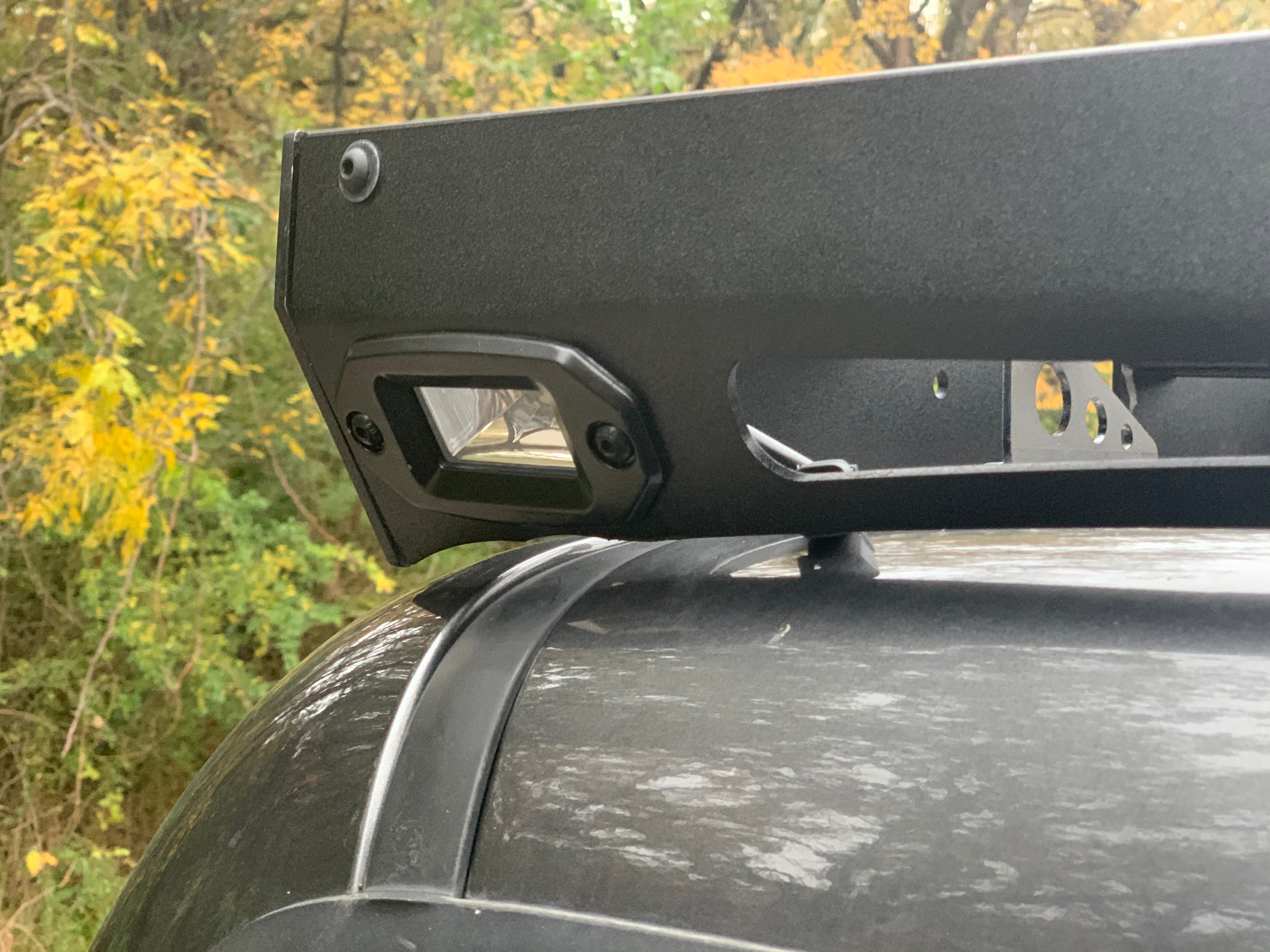 Close-up of roof rack with integrated LED light on an off-road vehicle