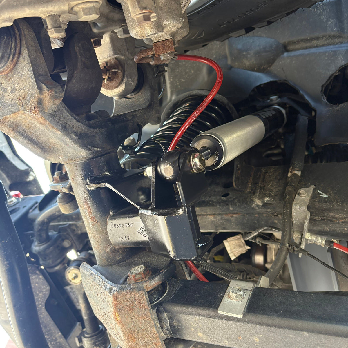 Clayton Off Road front lower shock relocation bracket for Jeep Wrangler JL and Gladiator JT