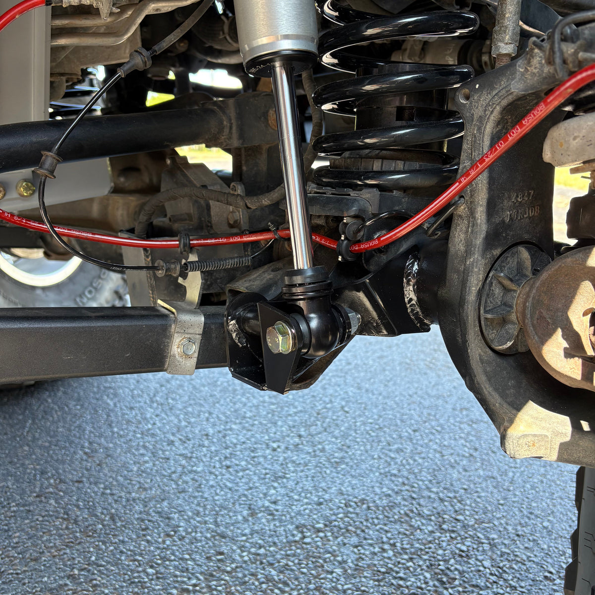 Clayton Off Road front lower shock relocation bracket for Jeep Wrangler JL and Gladiator JT