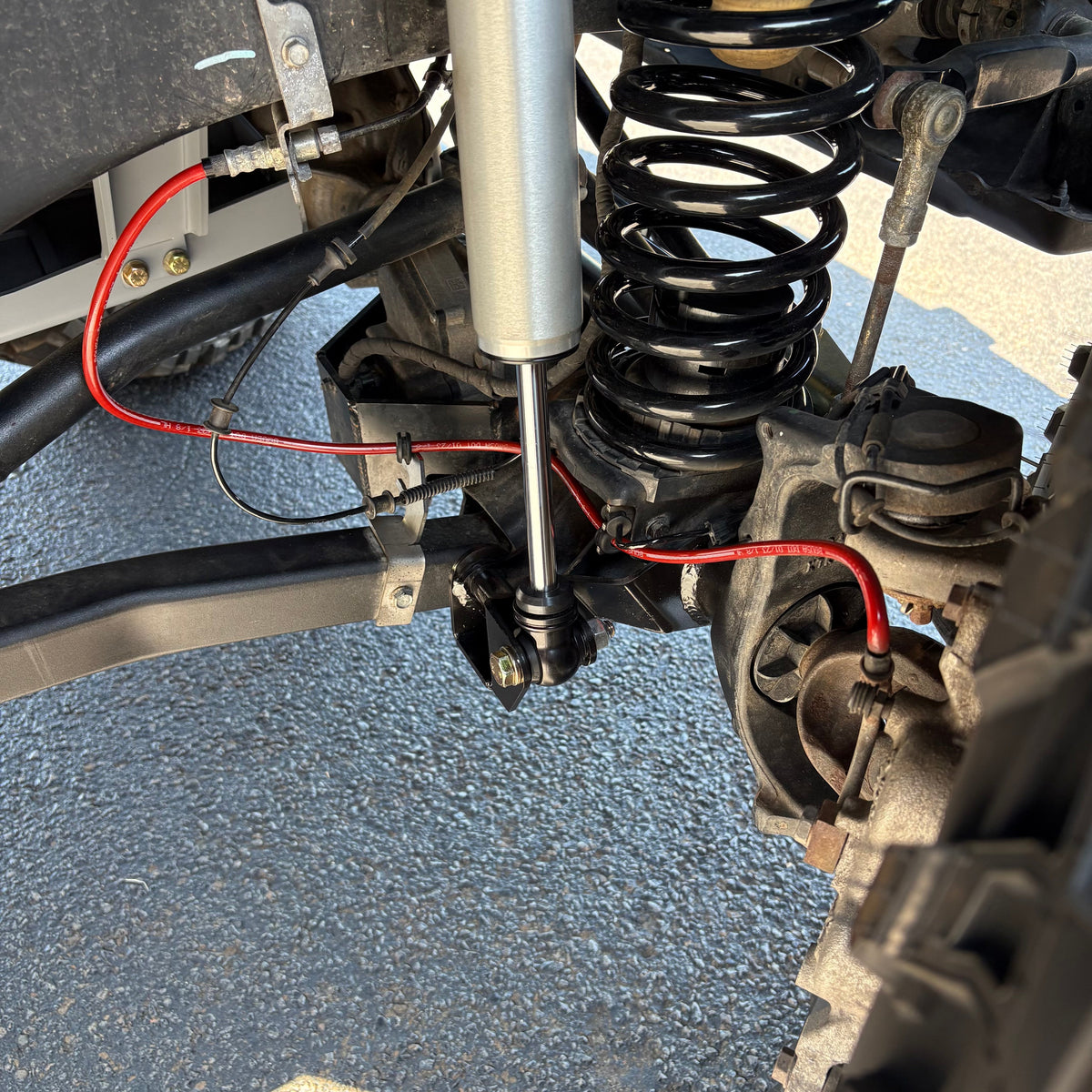 Clayton Off Road front lower shock relocation bracket for Jeep Wrangler JL and Gladiator JT