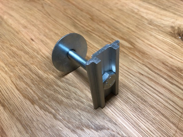 Aluminum T-slot bolt assembly with washer on wood background, for overlanding accessories
