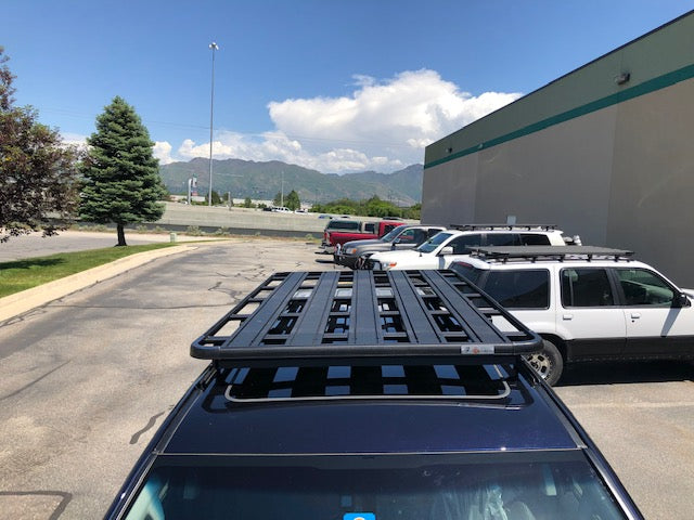 Heavy-duty roof rack mounted on SUV, ideal for overlanding and camping gear transport