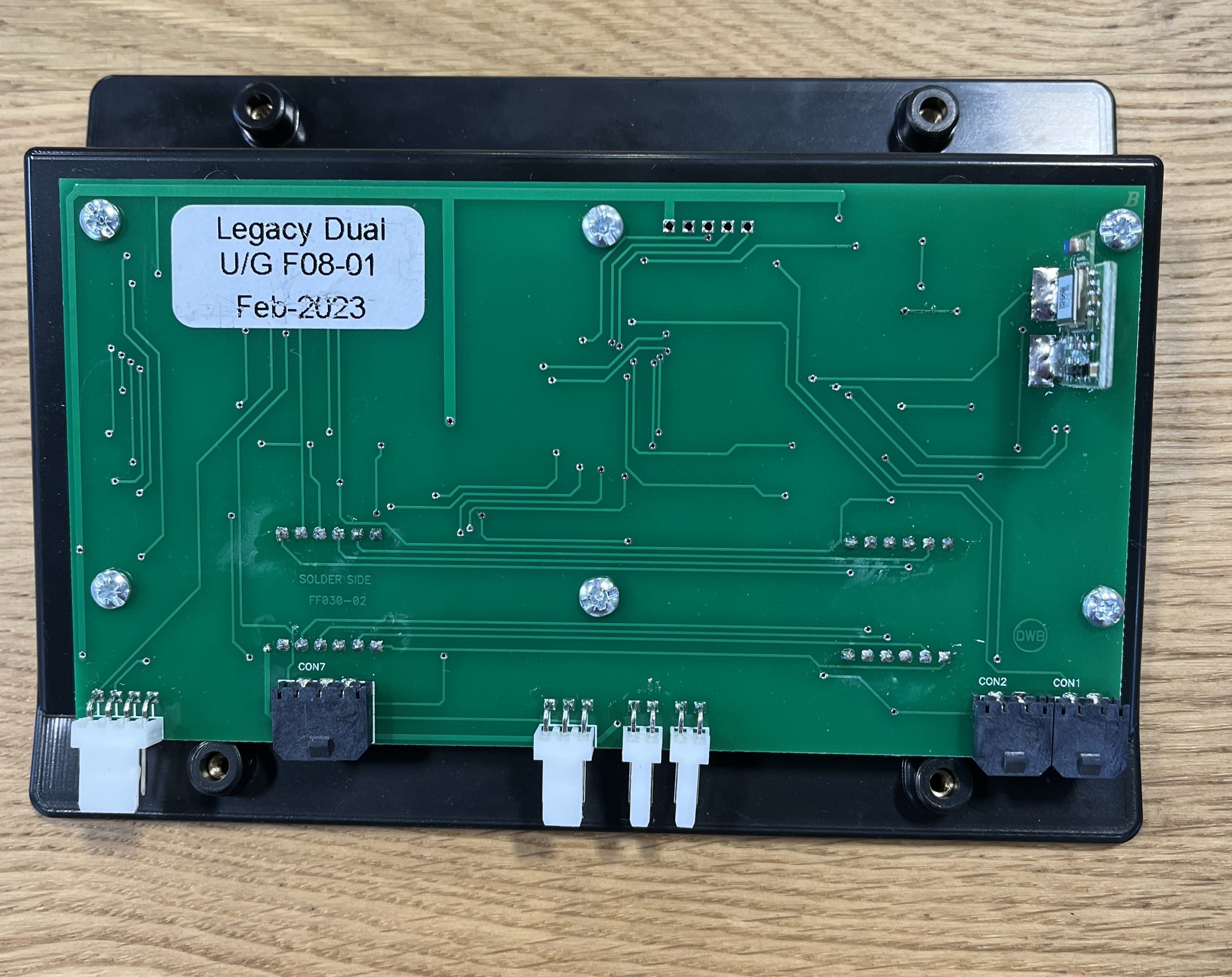 Legacy Dual U/G F08-01 electronic circuit board on wood surface, wiring connectors visible