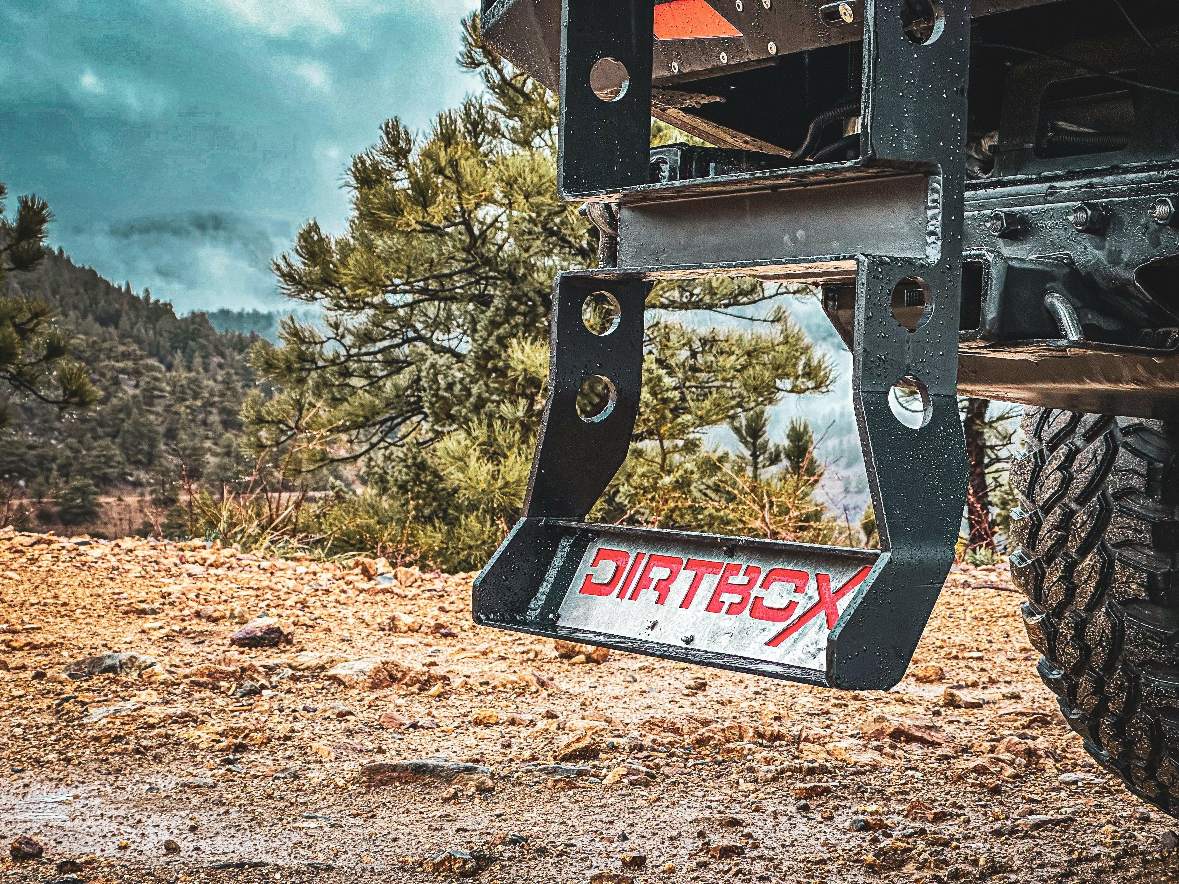 Dirtbox off-road rear bumper mount on expedition vehicle in rugged outdoor terrain