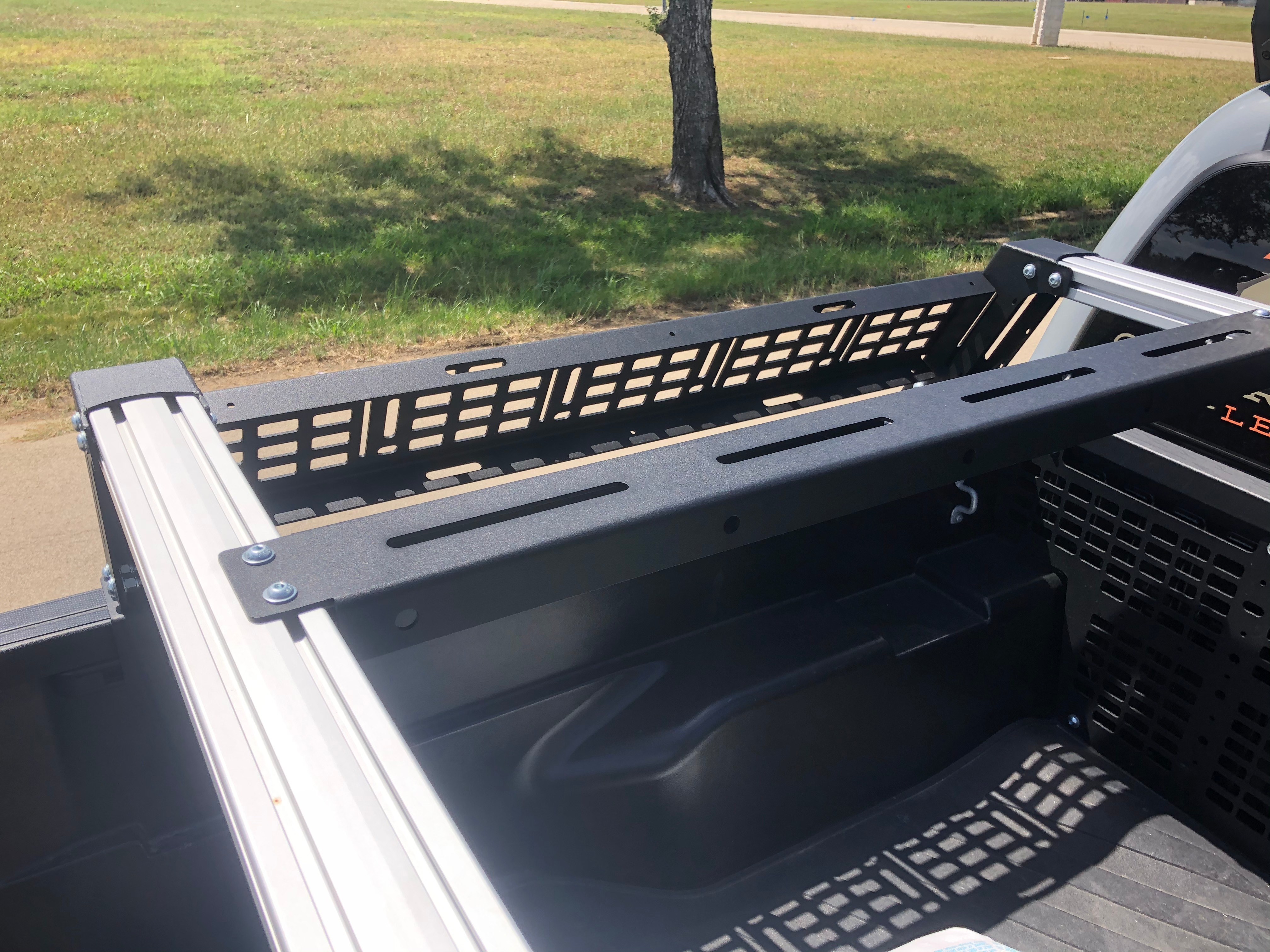 Overland bed rack system installed in a pickup truck for off-road and camping gear