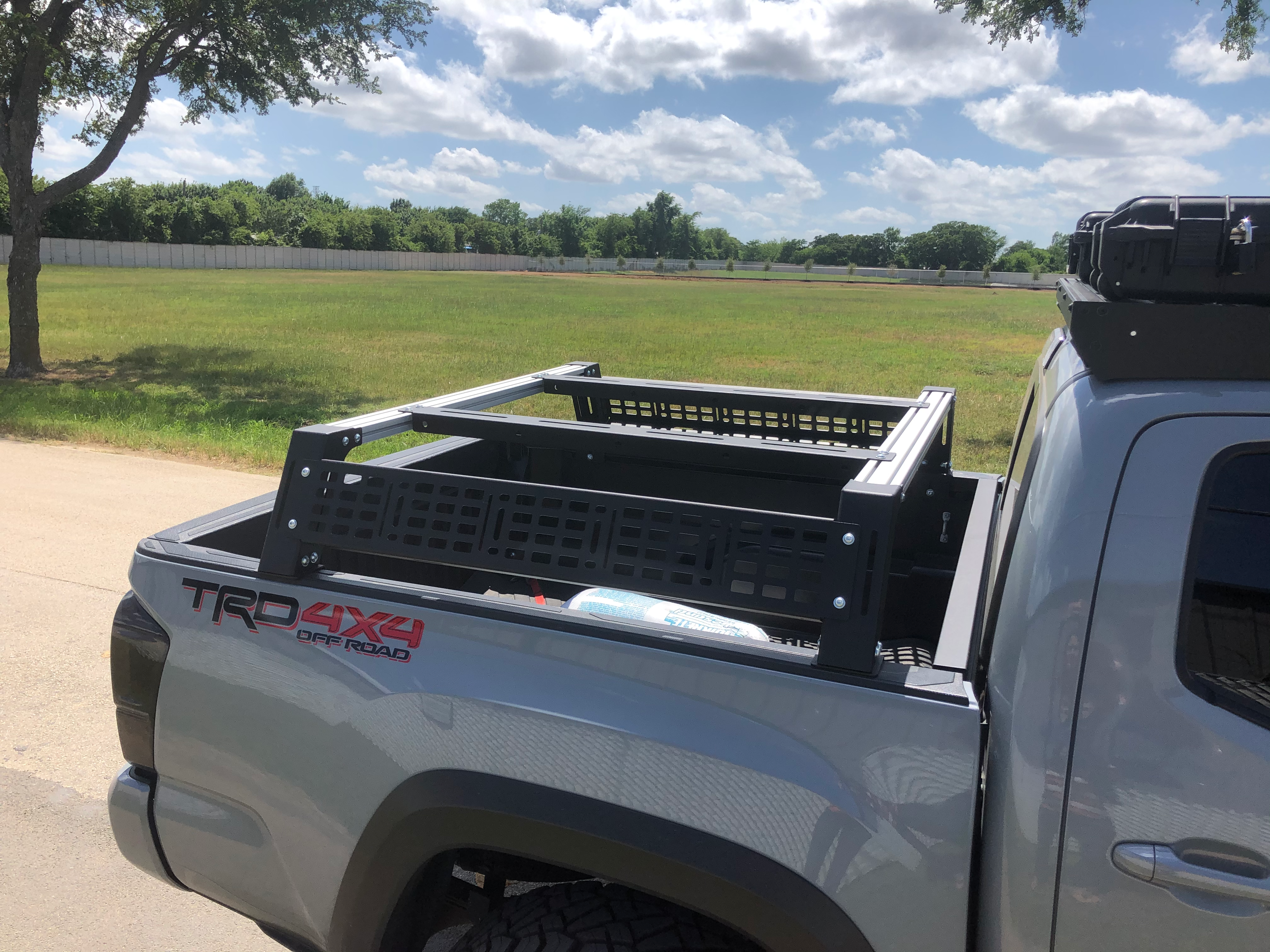 Overland bed rack mounted on pickup truck bed, ideal for Tacoma off-road camping setup