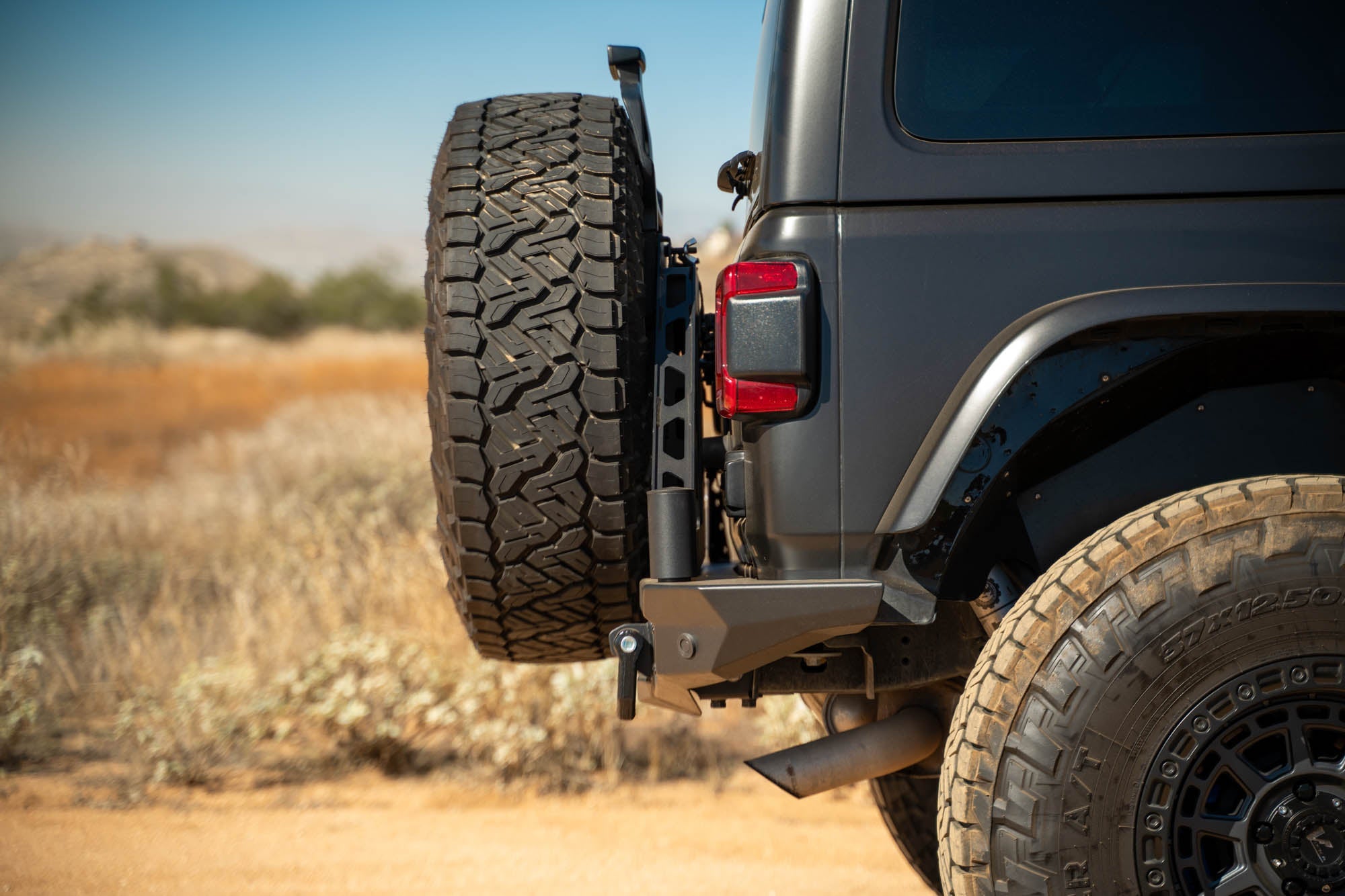 Jeep-JL-Bumper-Mounted-Tire-Carrier_Installed-01 - NVMOS