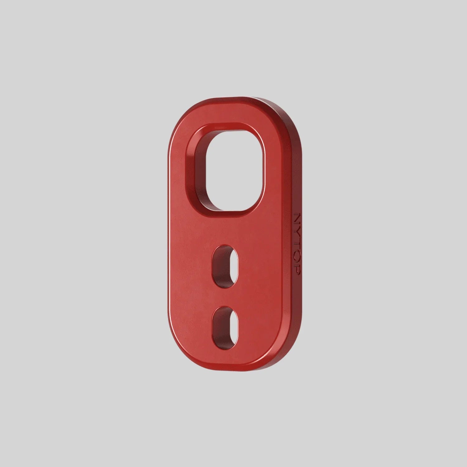 Red anodized recovery point tow hook accessory for off-road vehicles on grey background