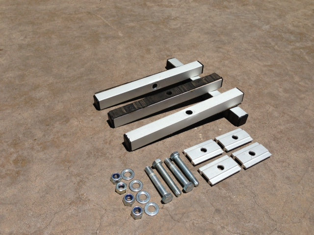 K9 tent mount kit for overlanding shown with bolts, nuts, washers, and aluminum bars on concrete