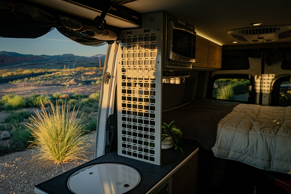 CAV pantry MOLLE panel in a Storyteller van kitchen