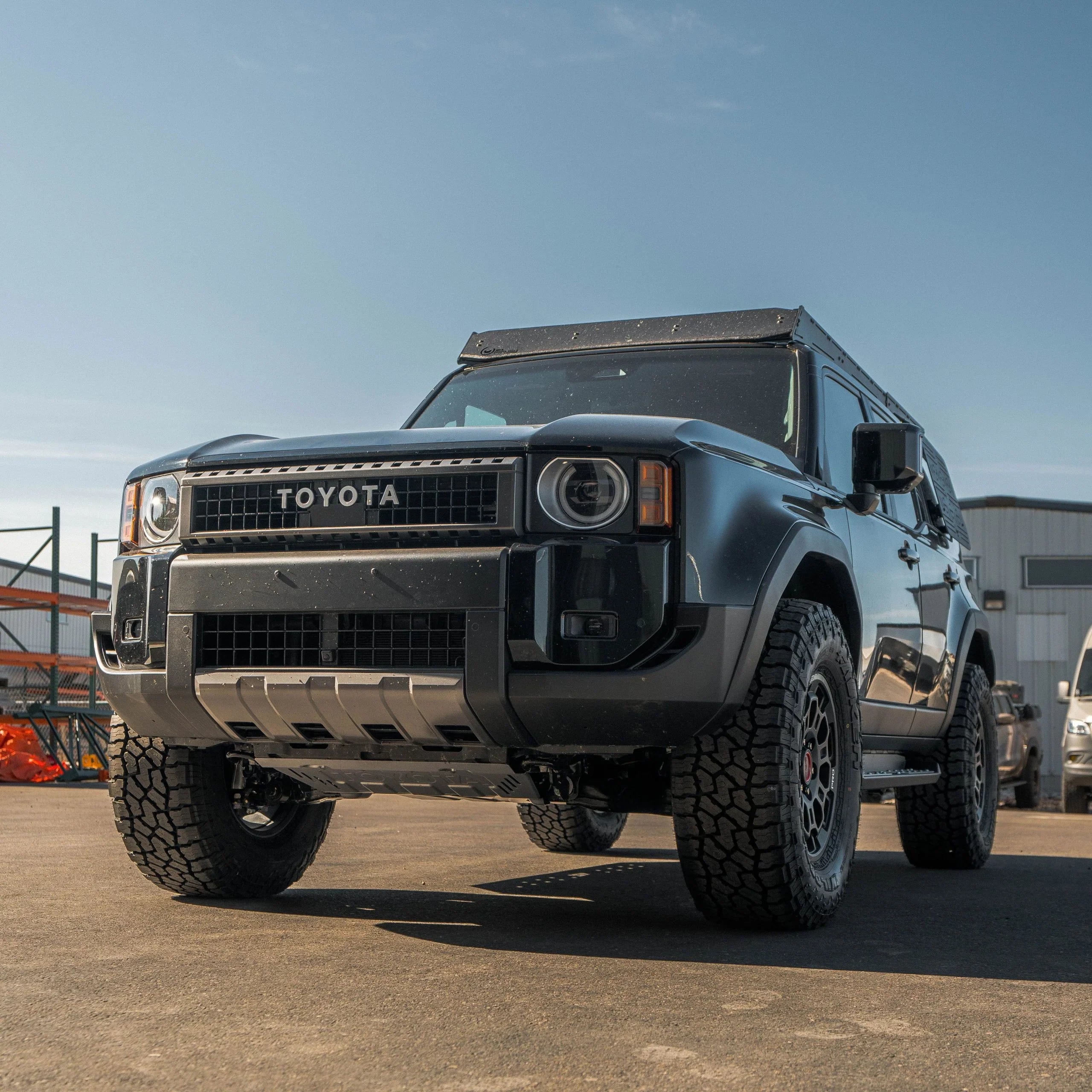 Toyota off-road SUV with rugged tires and aftermarket accessories parked outdoors