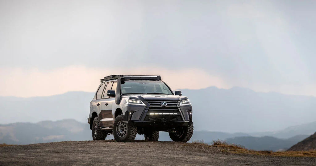 Lexus LX570 with off-road Covert front bumper on a mountain trail, adventure vehicle
