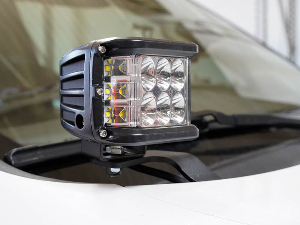 LED ditch light mounted on vehicle hood, overlanding accessory for off-road vehicles