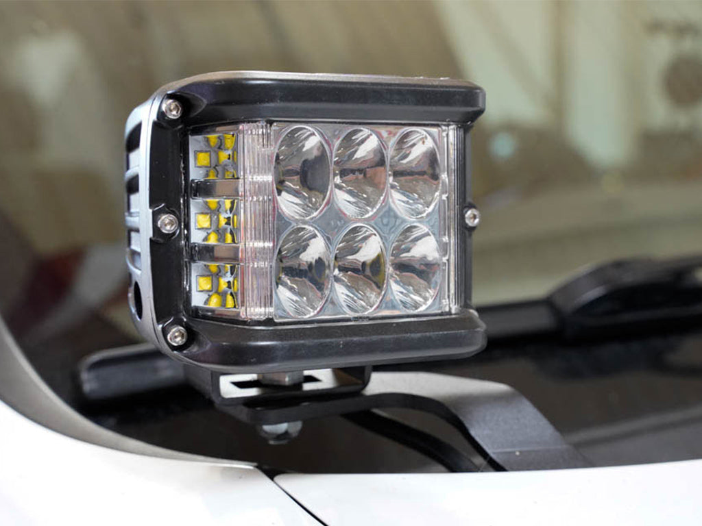 LED ditch light pod mounted on vehicle hood bracket for off-road overlanding