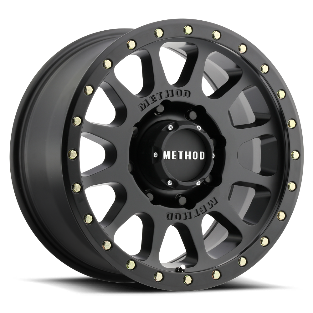 matte black off-road alloy wheel with multi-spoke design and beadlock accents