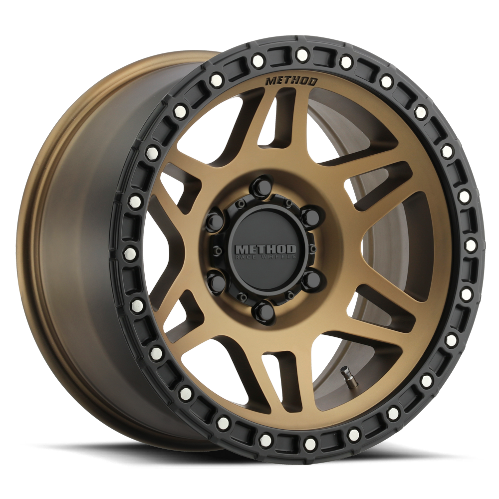 Bronze alloy off-road wheel with matte black lip and beadlock-inspired accents