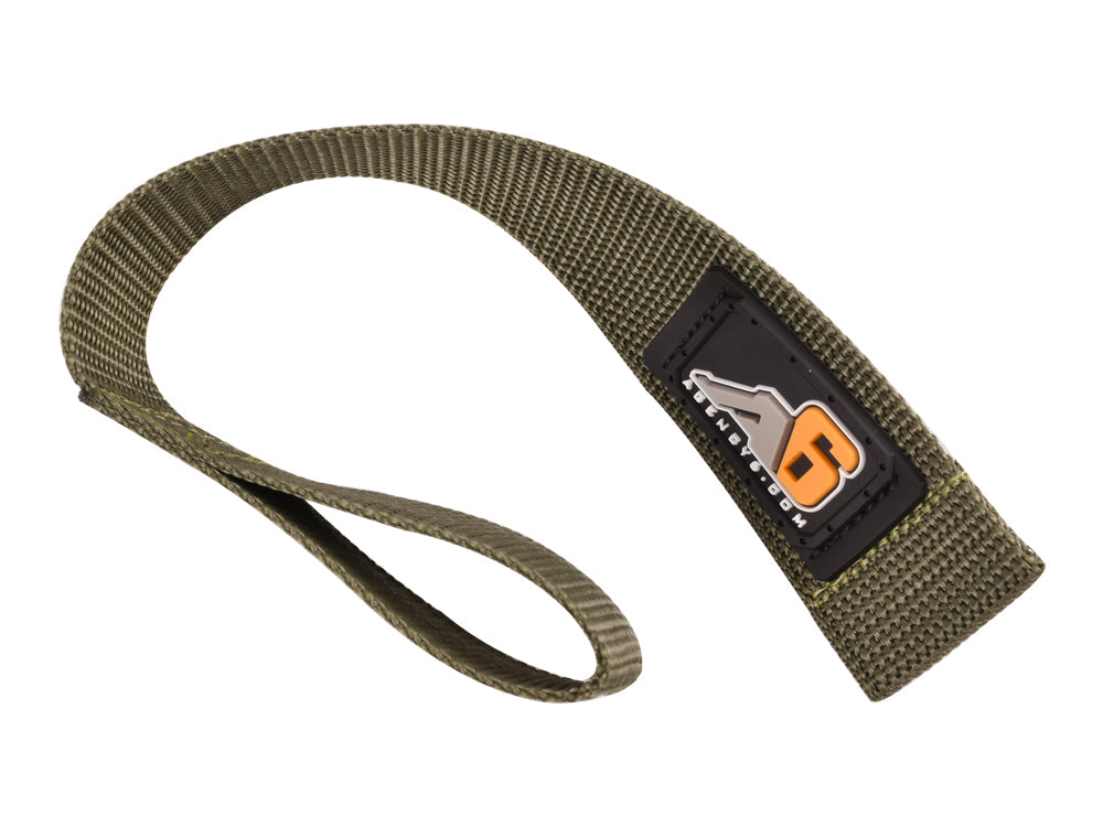 Heavy-duty nylon recovery strap with black and orange patch for off-road vehicles