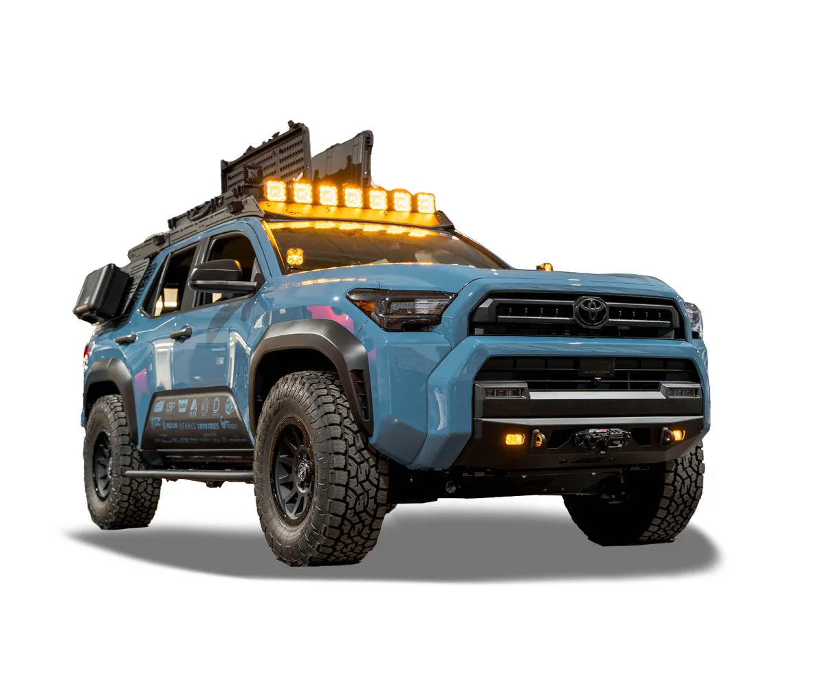 Blue Toyota 4Runner overland build with off-road lights, roof rack, and rugged accessories