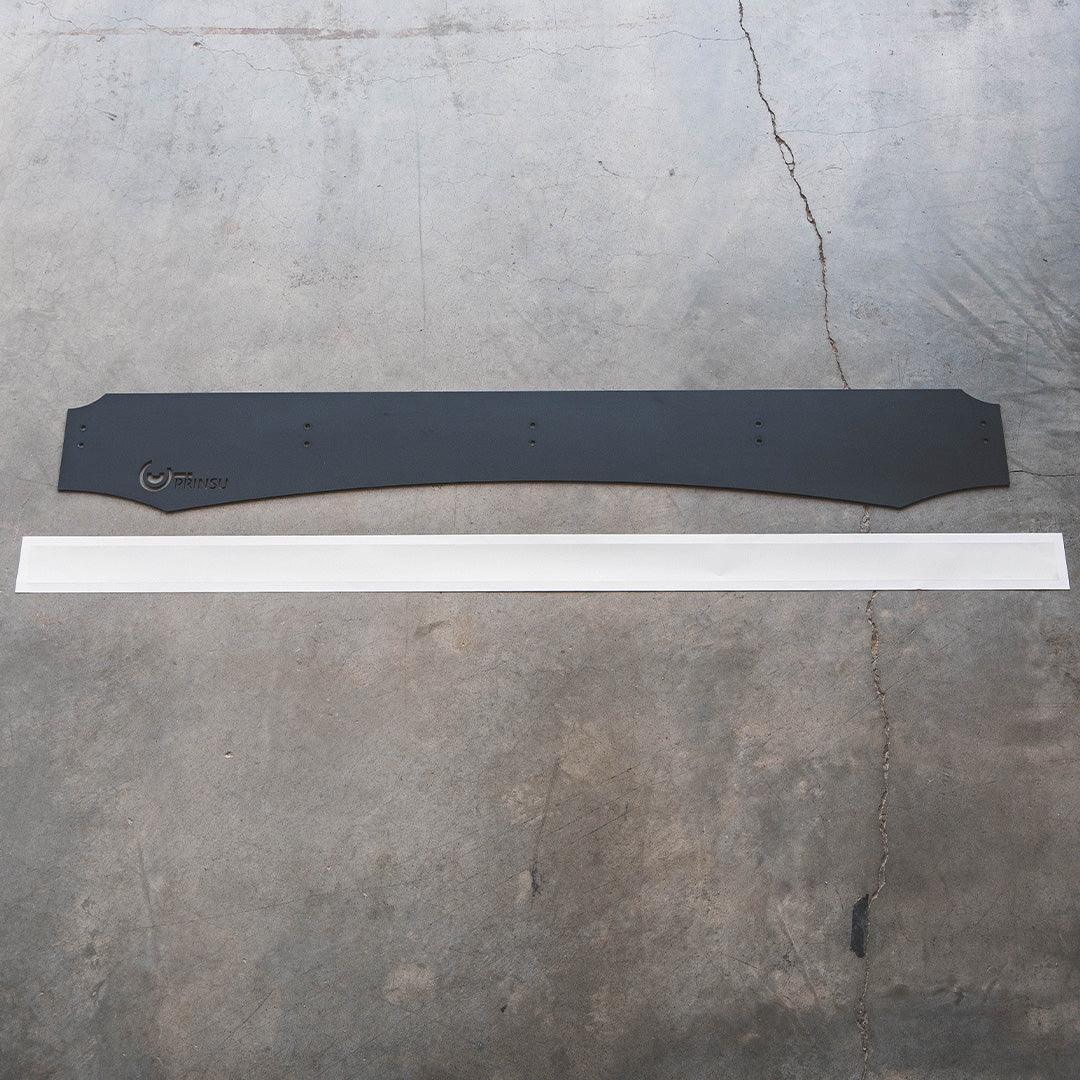 Black Prinsu roof rack wind deflector and white strip on concrete floor