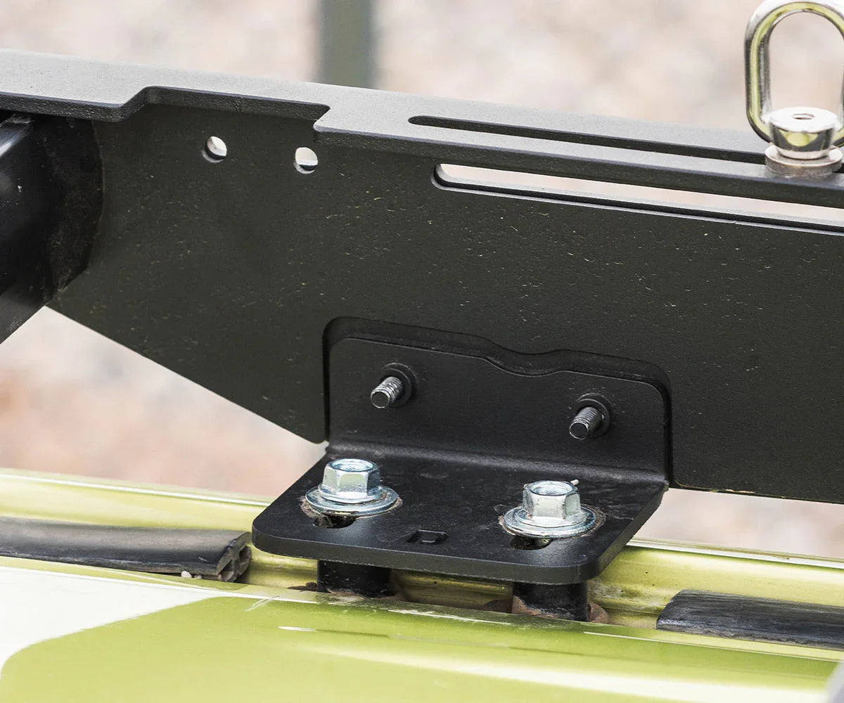 Close-up of a roof rack mounting bracket on a Toyota 4Runner for overlanding accessories.