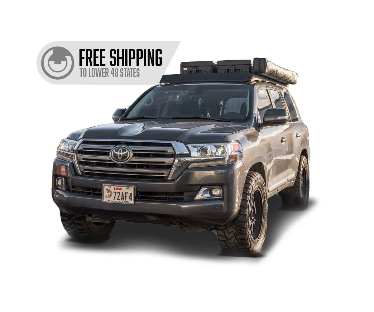 Toyota Land Cruiser with roof rack and awning, off-road tires, free shipping banner